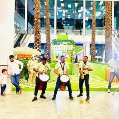 African drummers performing in a bright mall atrium