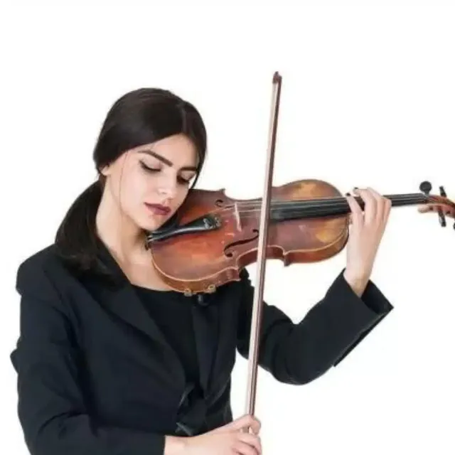 Female violinist in a black blazer playing against a white background