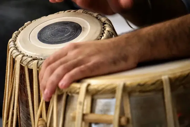 Close-up of hands playing tabla drums